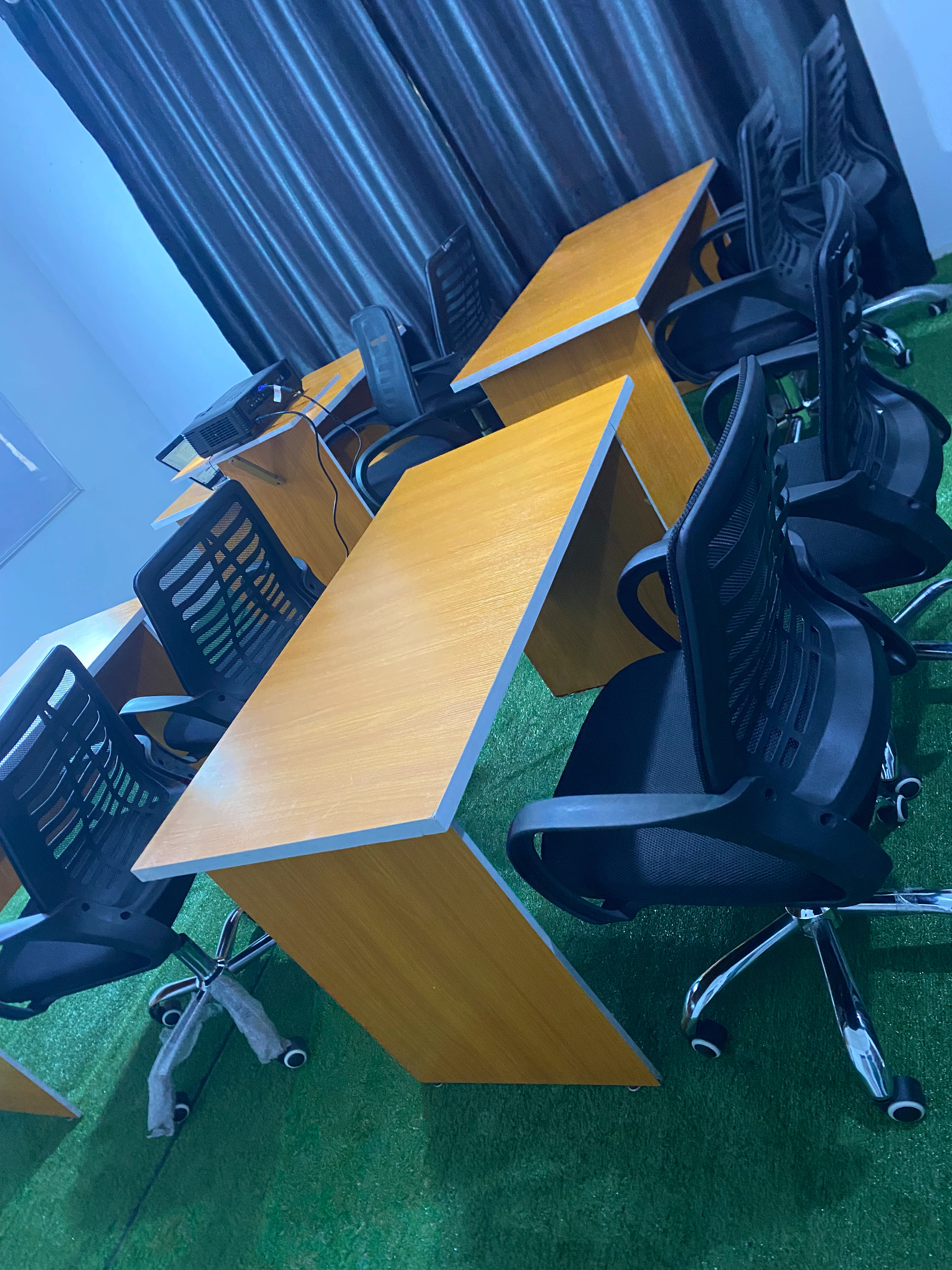 Spacious, well-equipped classroom at Geegstack Academy with ergonomic chairs and projector