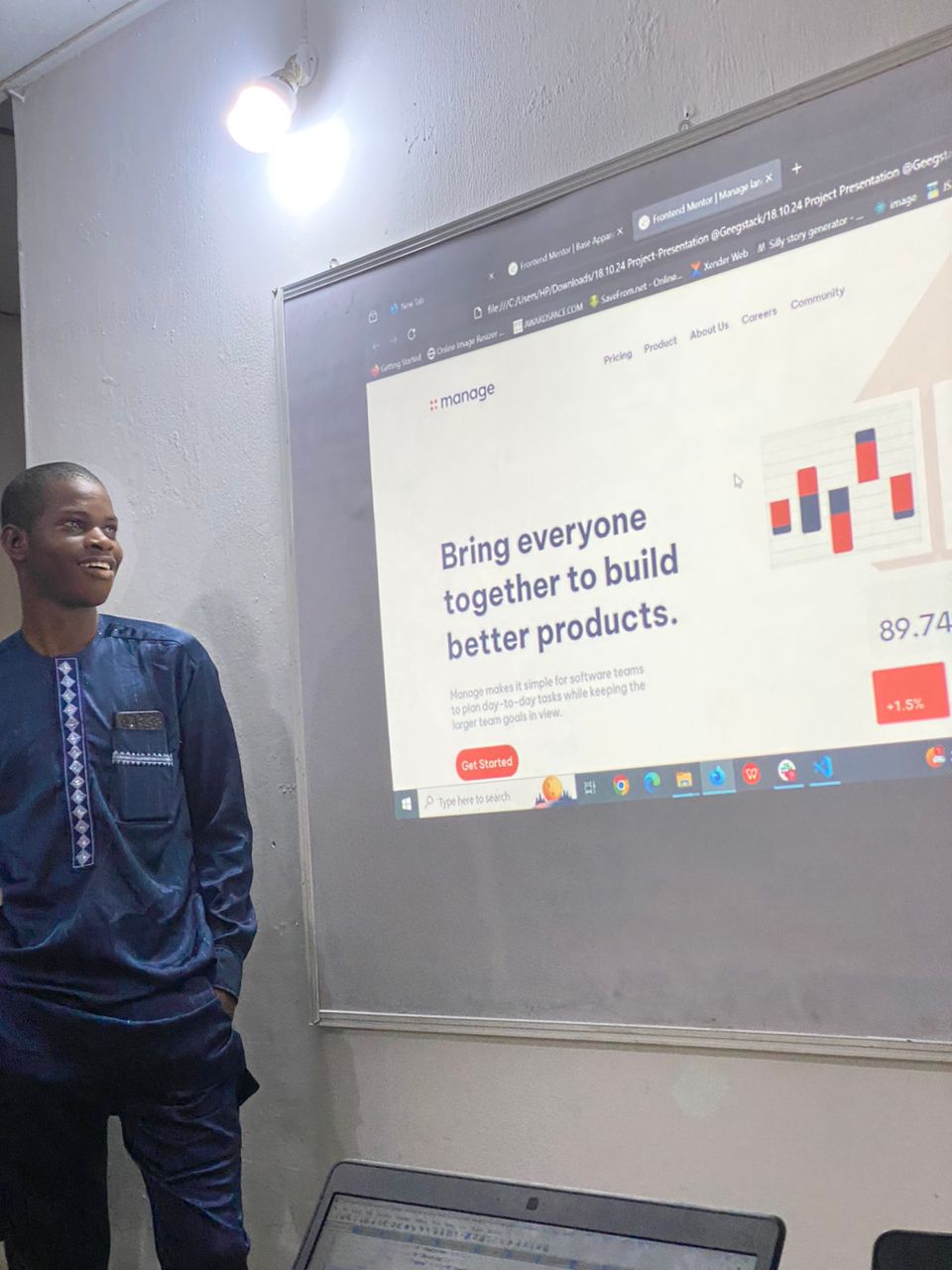 A Geegstack Academy student proudly presenting his completed frontend project on the classroom projector